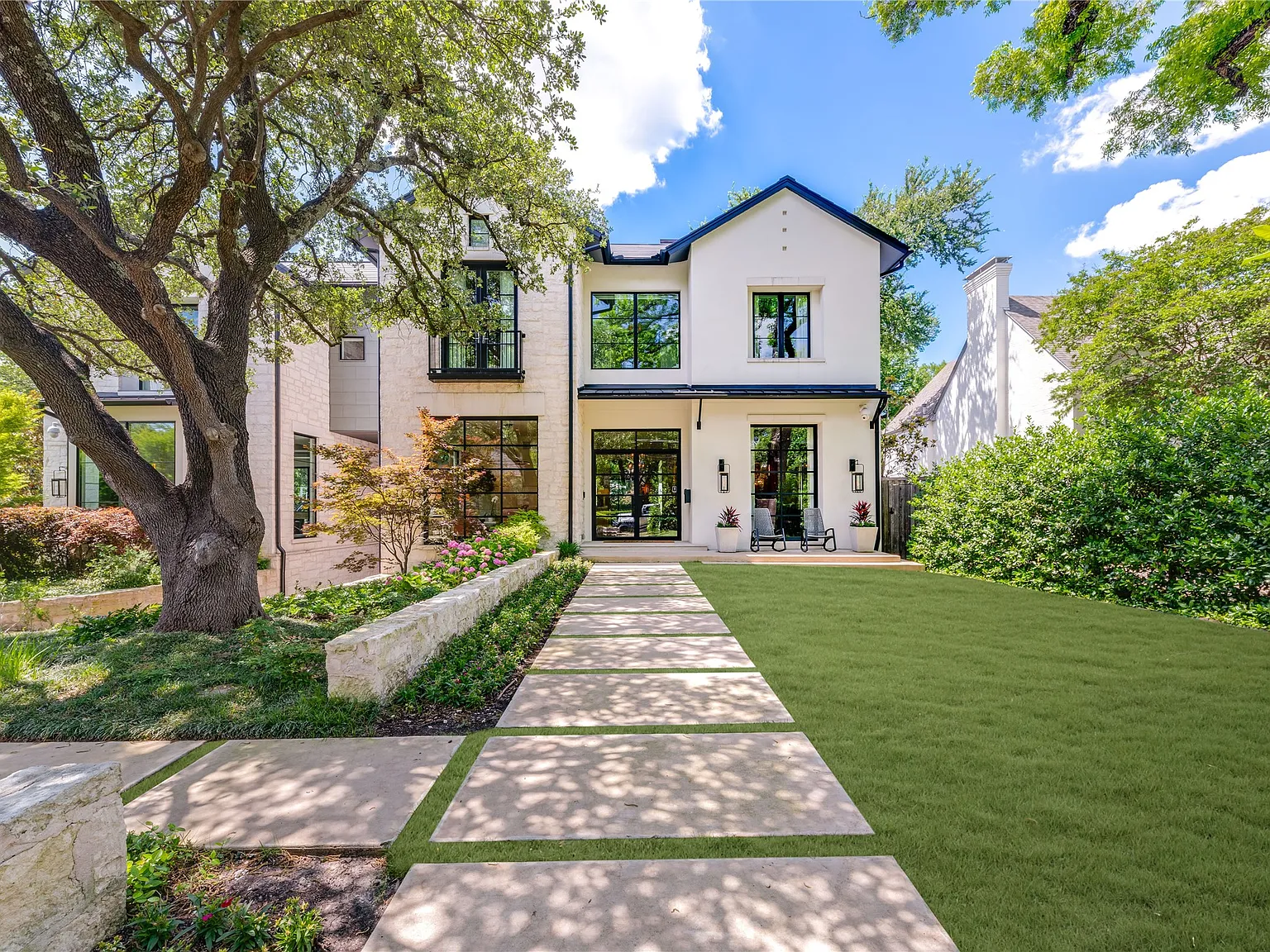 Modern residential elevation and landscaped front approach