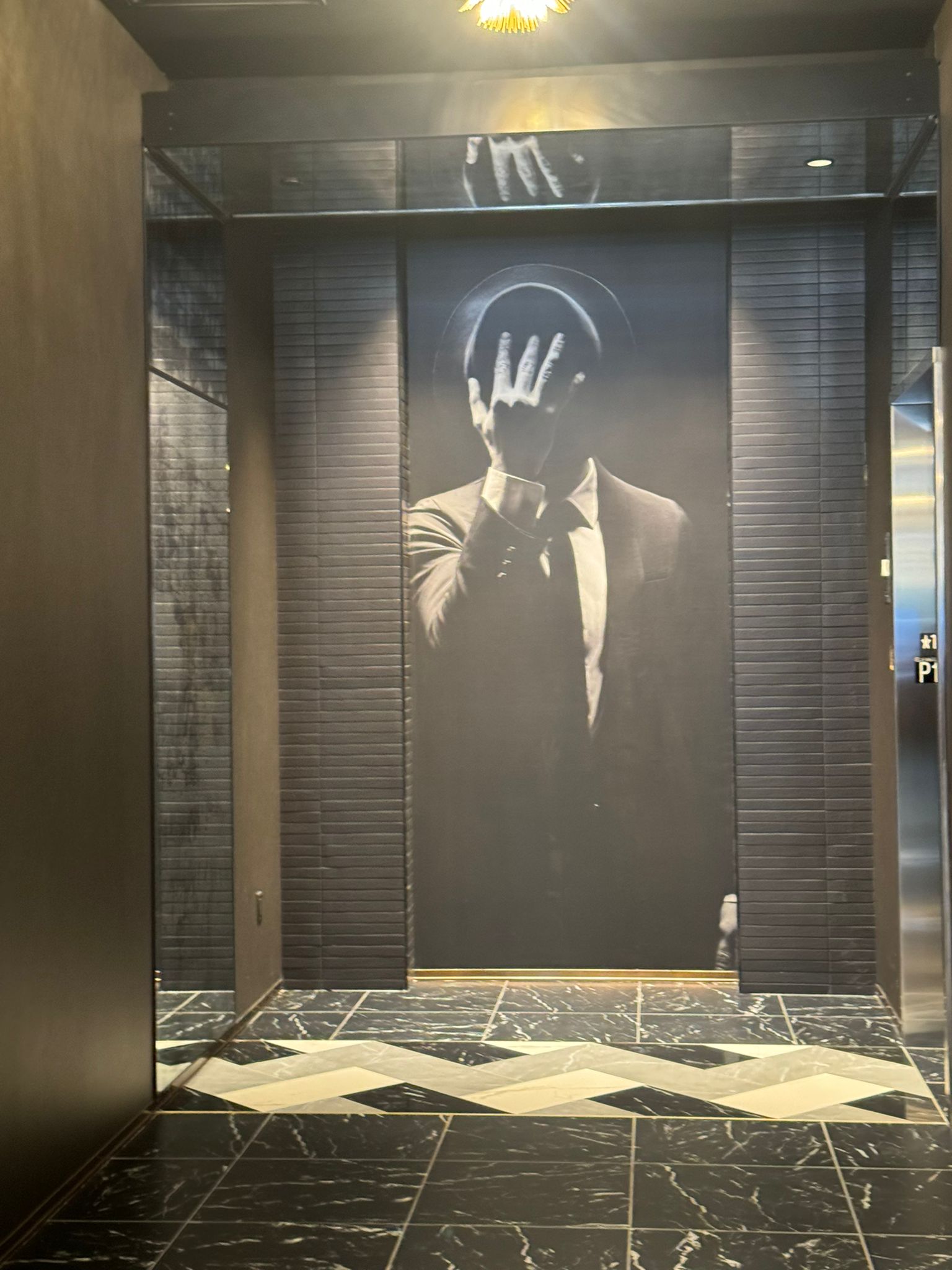 Custom black-and-white mural installed in a commercial lobby